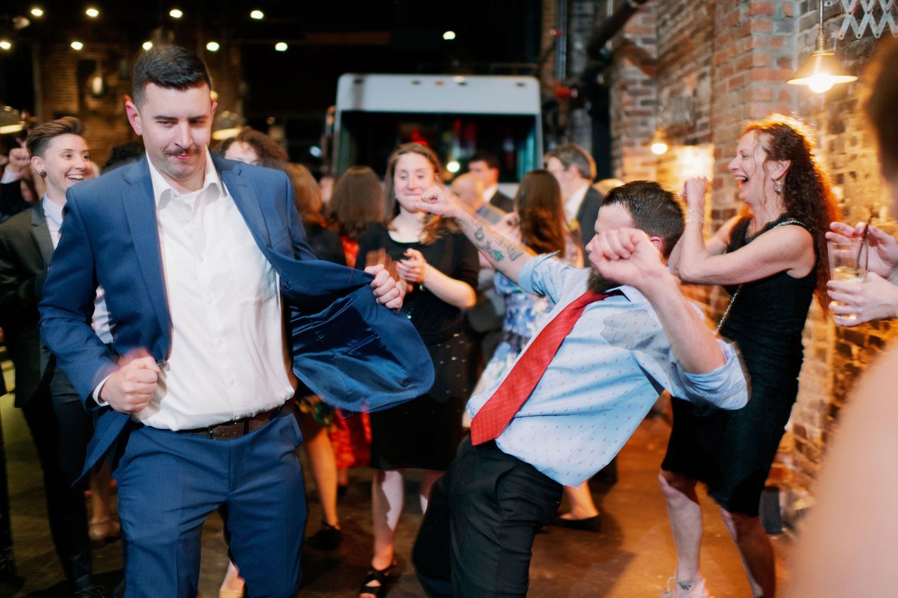 Wedding guests having fun dancing