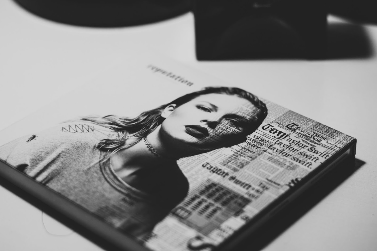 Black and white photo of Taylor Swift's Reputation album