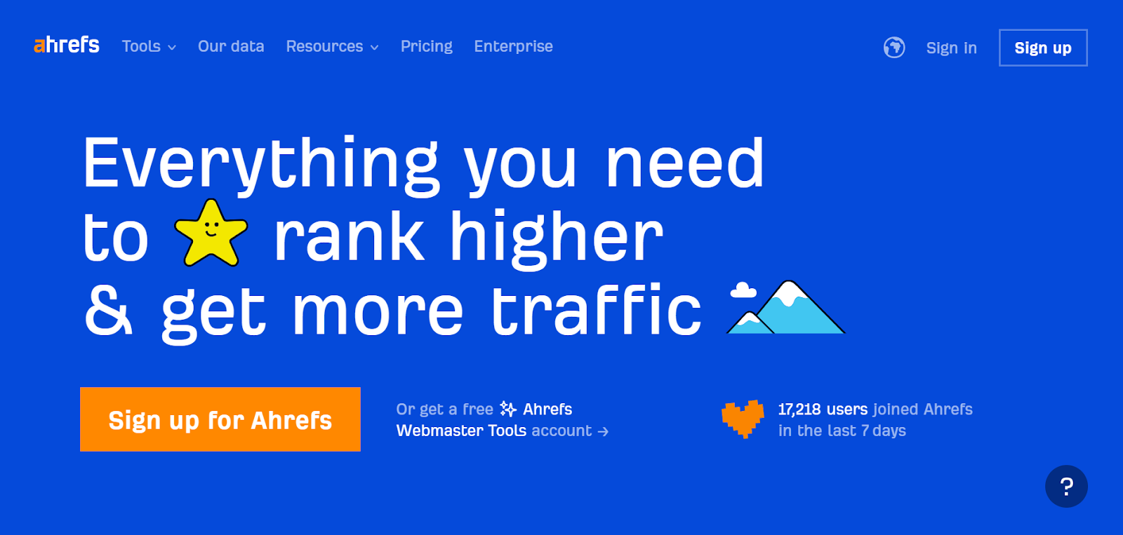 A screenshot of Ahrefs' home page displaying the top navigation menu, login, and sign-up buttons.