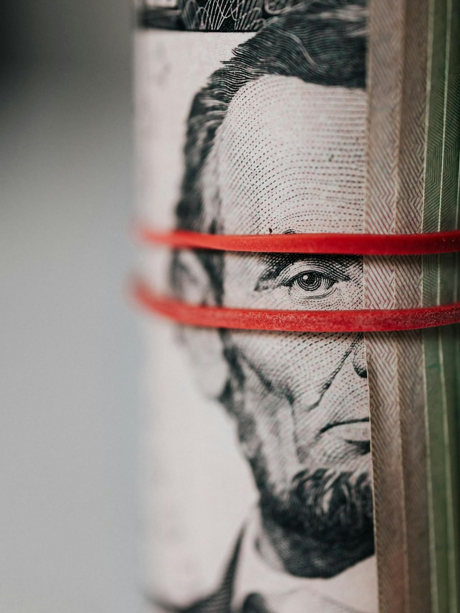 Roll of U.S. dollars wrapped in a rubber band