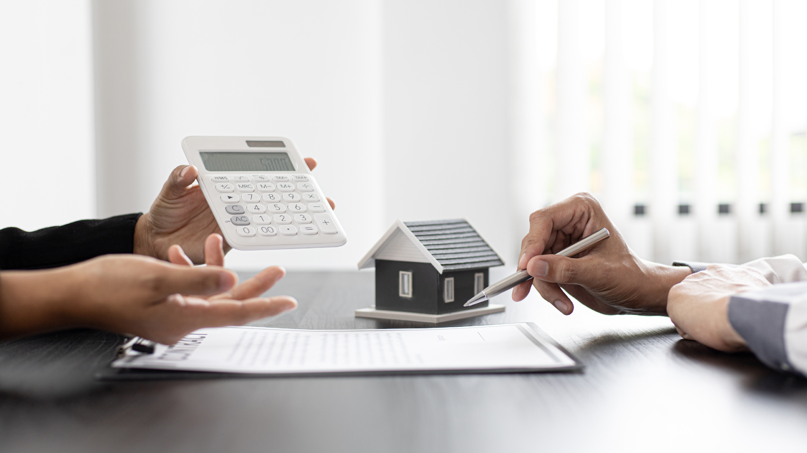 Calculating the expenses of managing taxes when an NRI sells inherited property in India.