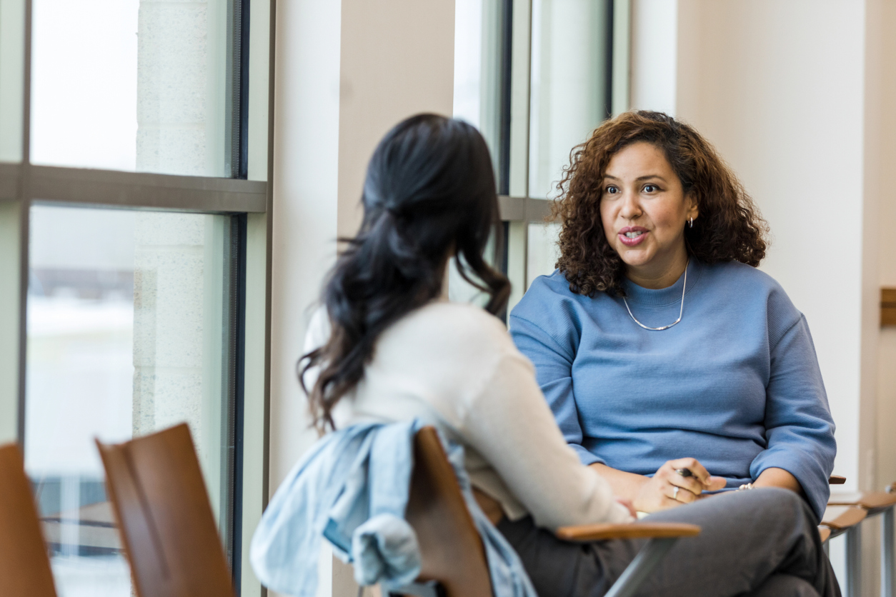 woman actively listening in blue shirt