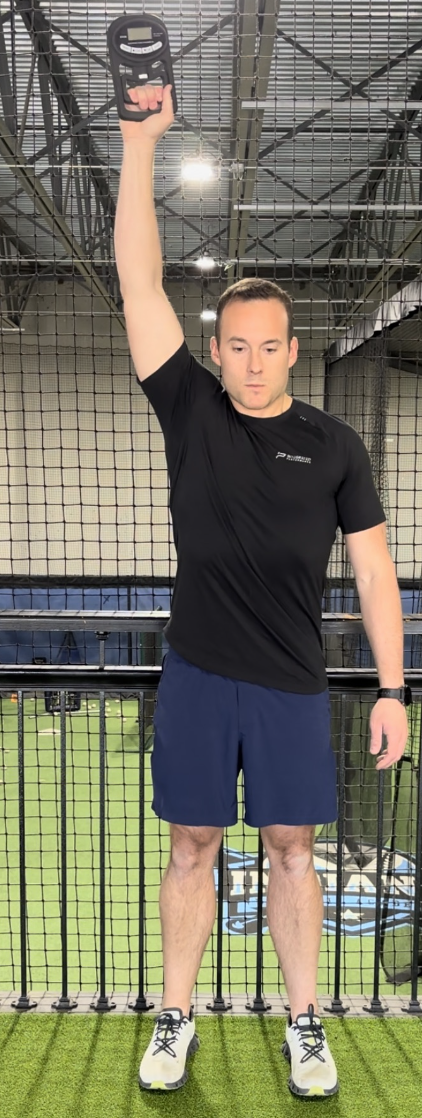 Demonstration of grip strength with elbow straight overhead