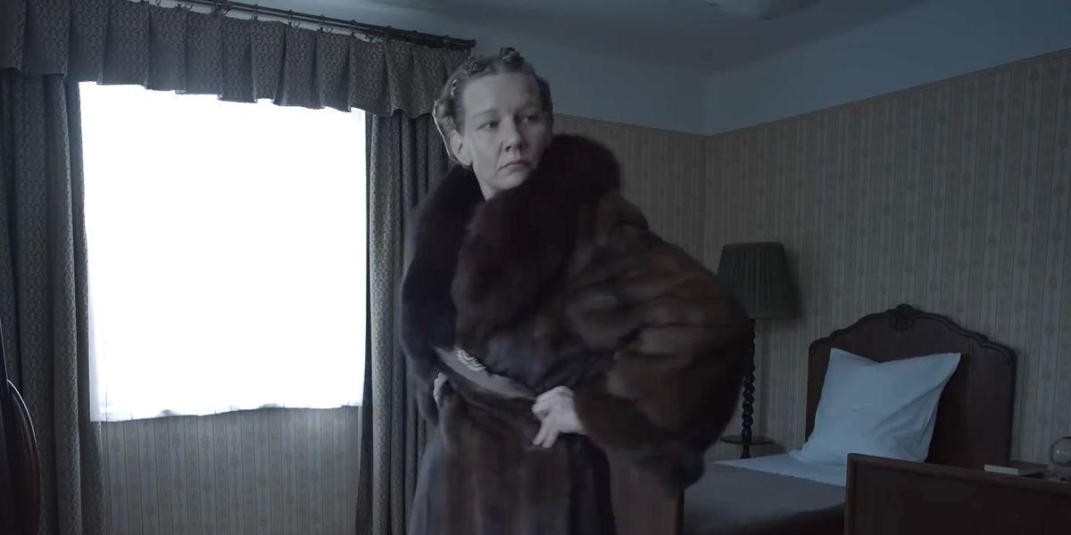 A person in a fur coat

Description automatically generated