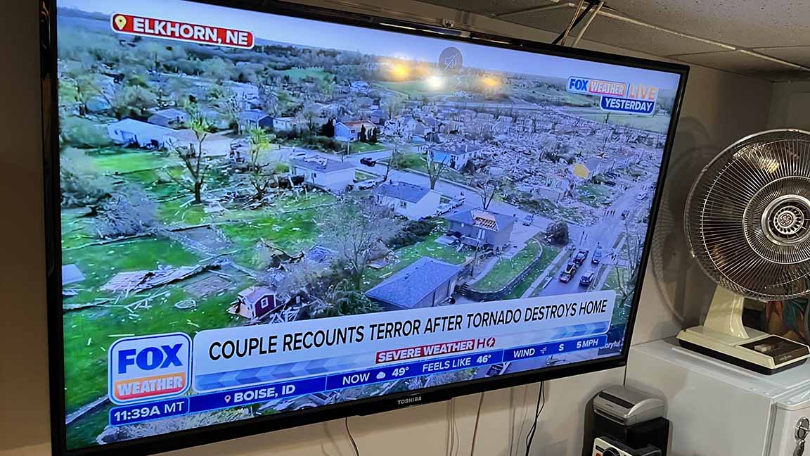 Image of tornado devastation in Elkhorn, NE, with Chyron: COUPLE RECOUNTS TERROR AFTER TORNADO DESTROYS HOME