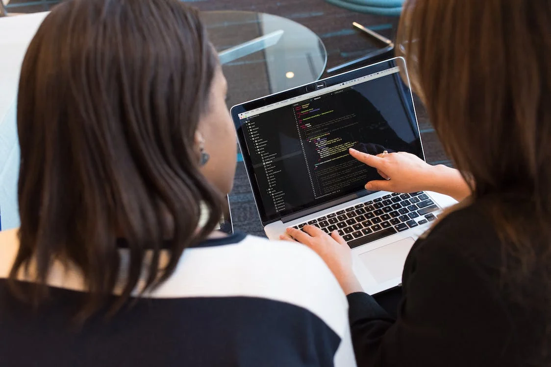 two people working on a coding project