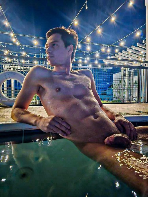 Dakota Wonders sitting naked in the rooftop hot tub showing off his naked wet body and cut erect penis