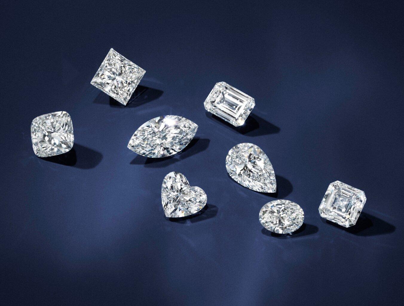 Assortment of loose blockchain diamonds in different shapes.