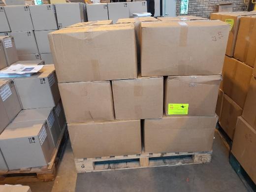 A pallet full of cardboard boxes

Description automatically generated with low confidence