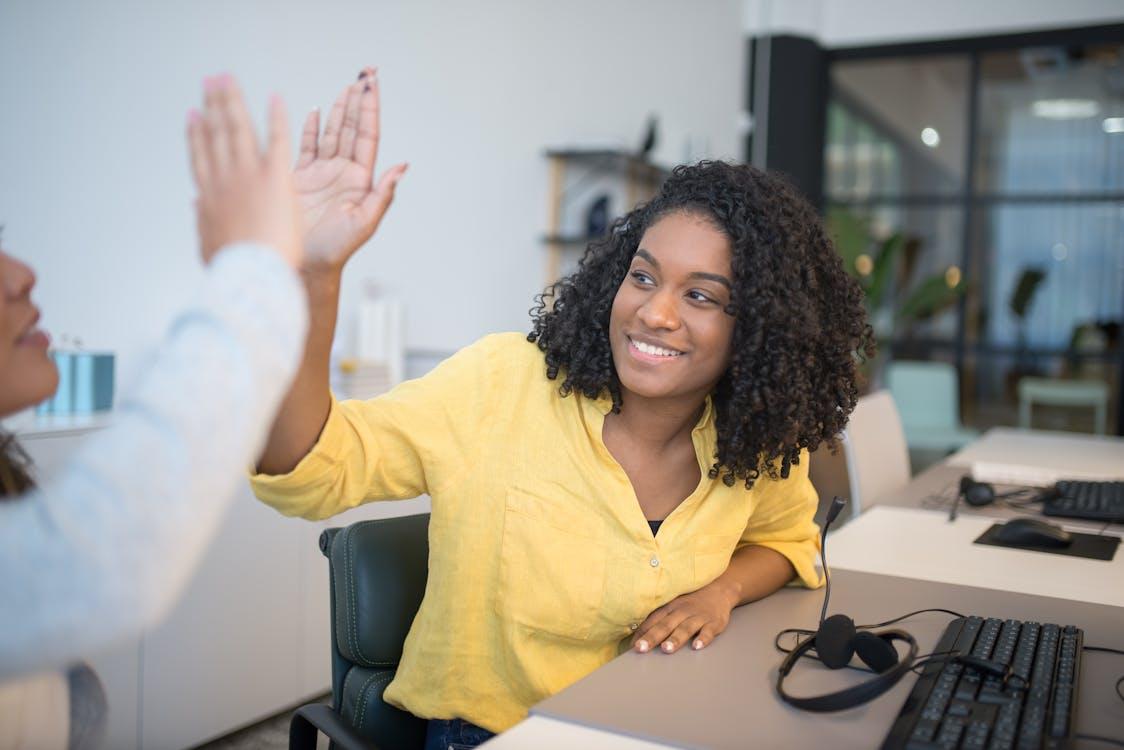 Free Call Center Employees Giving High Fives Stock Photo