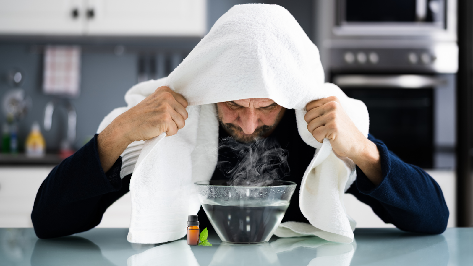 a man inhaling steam with diffused essential oil