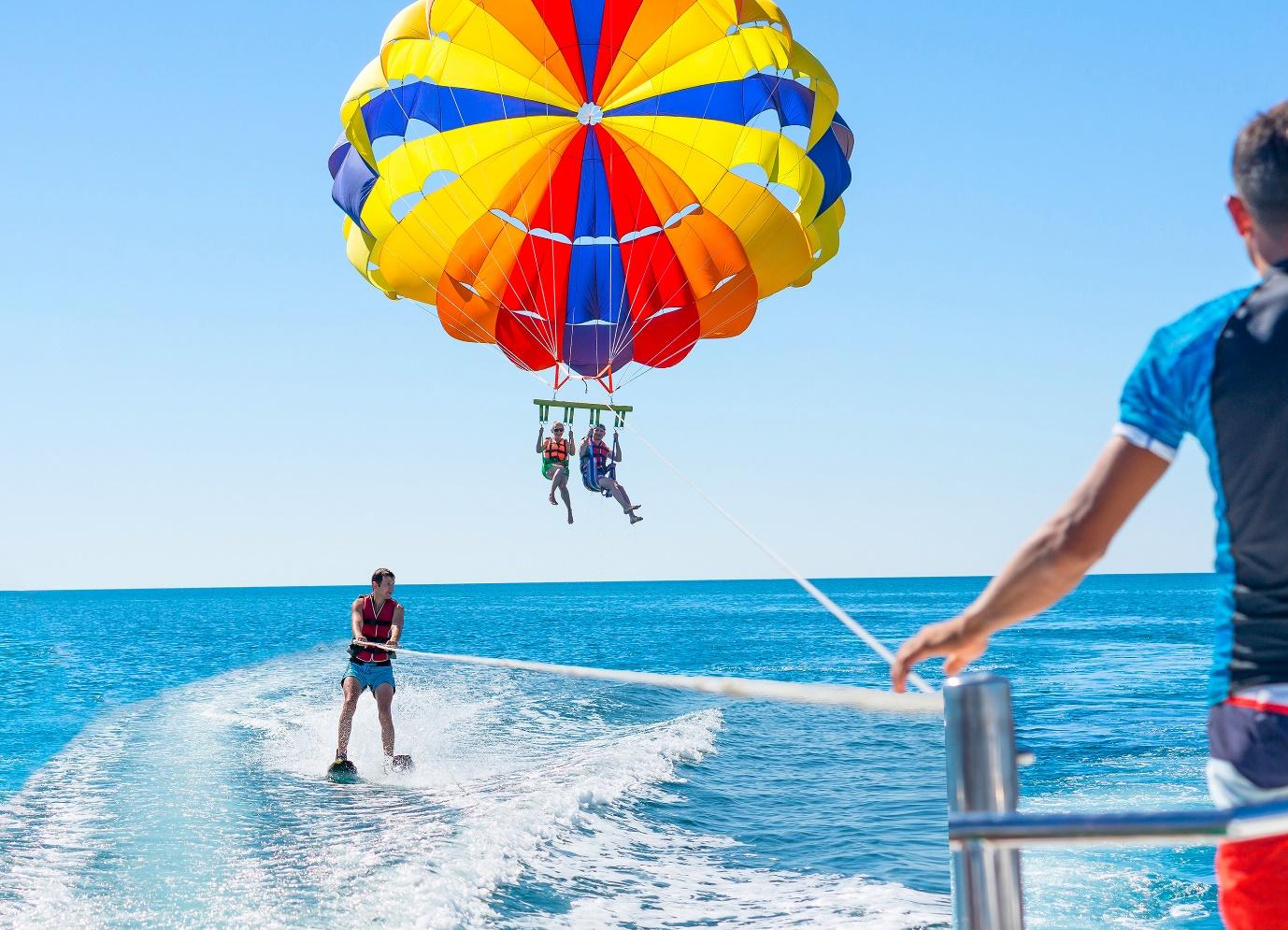People parasailing on a boat

Description automatically generated