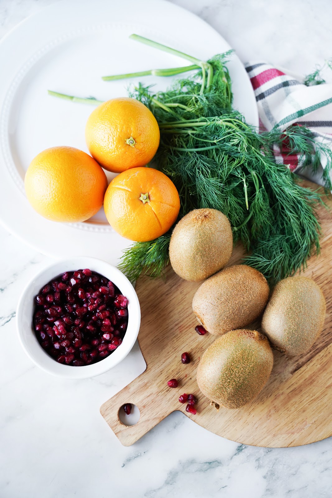 Kiwi, pomegranate arils, oranges, dill 