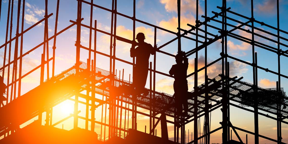 Florida osha regulations being followed by two workers on a scaffold. 