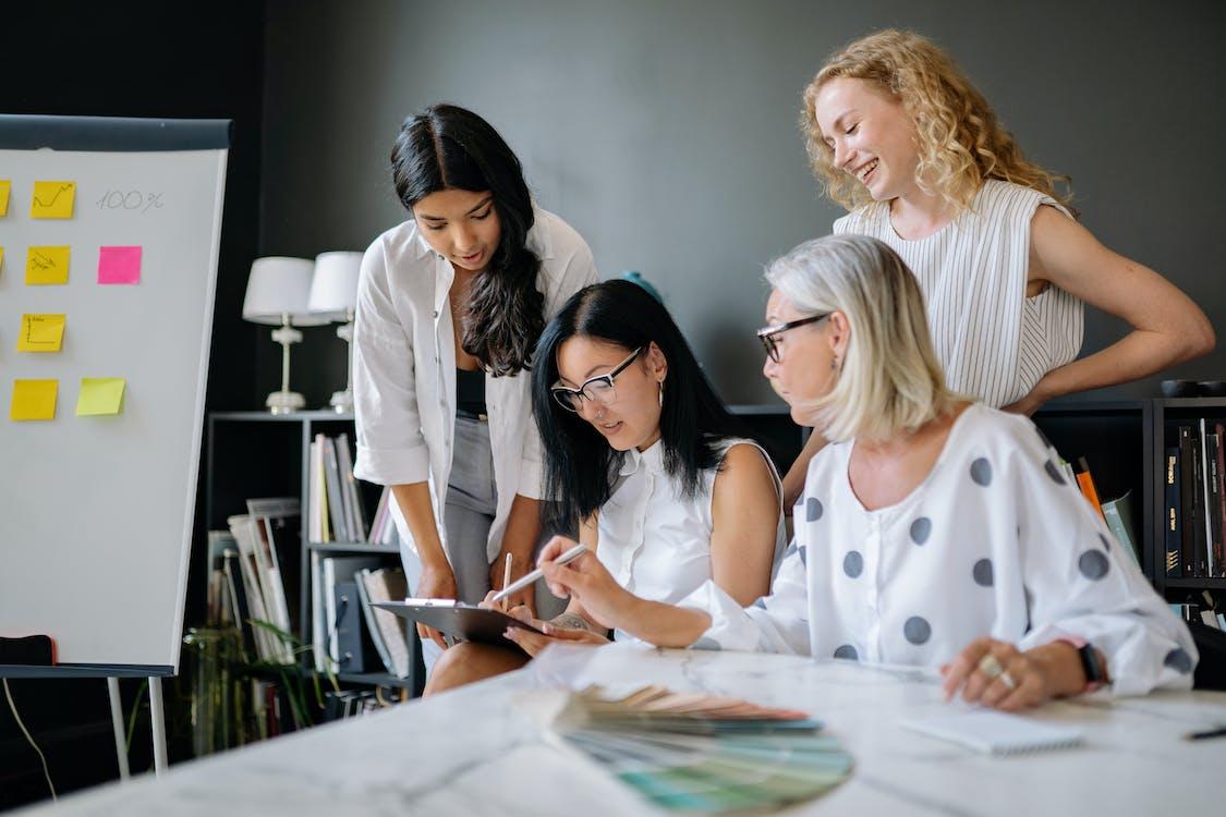 Free Women Discussing a Work Together Stock Photo