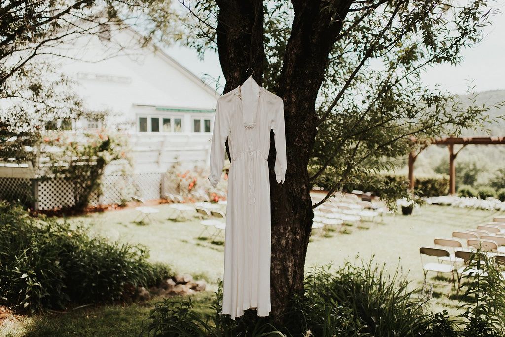 Wedding dress hanging from tree