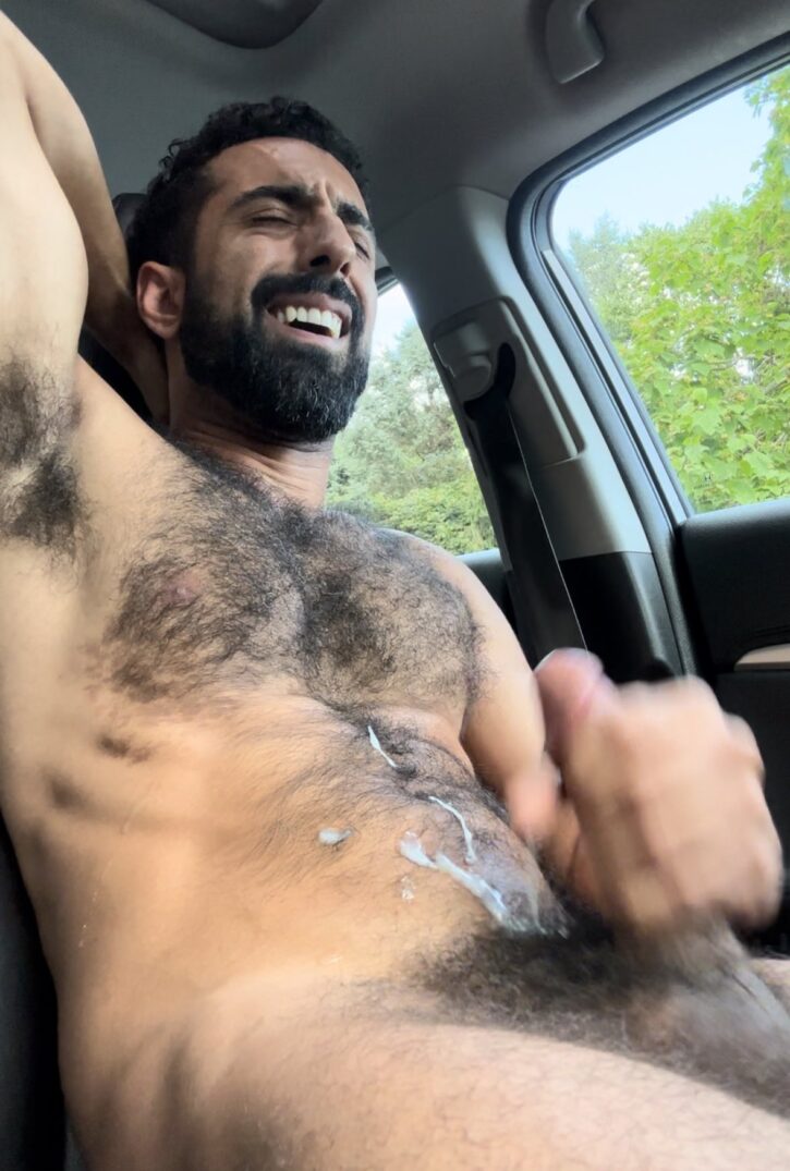 Ali Rush stroking his cock naked in the car jizzing all over his hairy chest and abs with his arm behind his back
