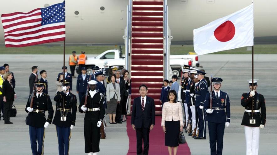 Japan's Prime Minister Fumio Kishida, center left, and his wife Yuko Kishida, center right, participate in an arrival ceremony at Andrews Air Force Base, Md., Monday, April 8, 2024. President Joe Bide