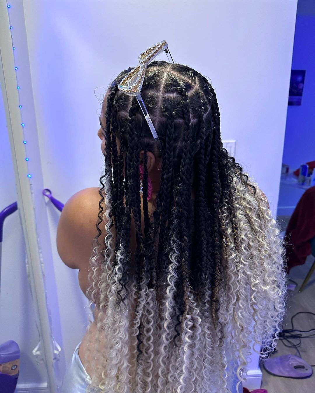 Back view of a lady showing of her grey curly ends 