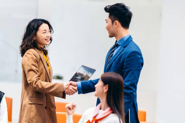 2,800+ Chinese Businessman Shaking Hands Stock Photos, Pictures &  Royalty-Free Images - iStock | Asian businessman shaking hands