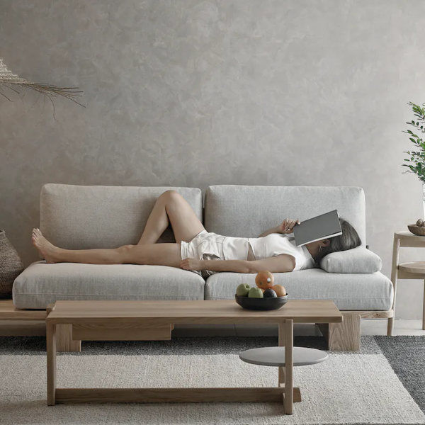 3-seater grey sofa upholstered in fabric with wooden legs