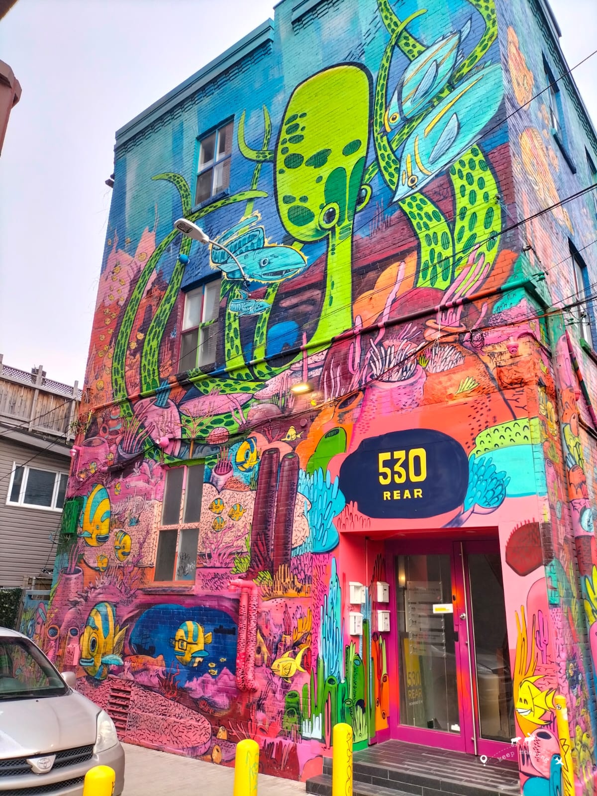 The facade of a building completely filled with graffiti in Graffiti Alley.