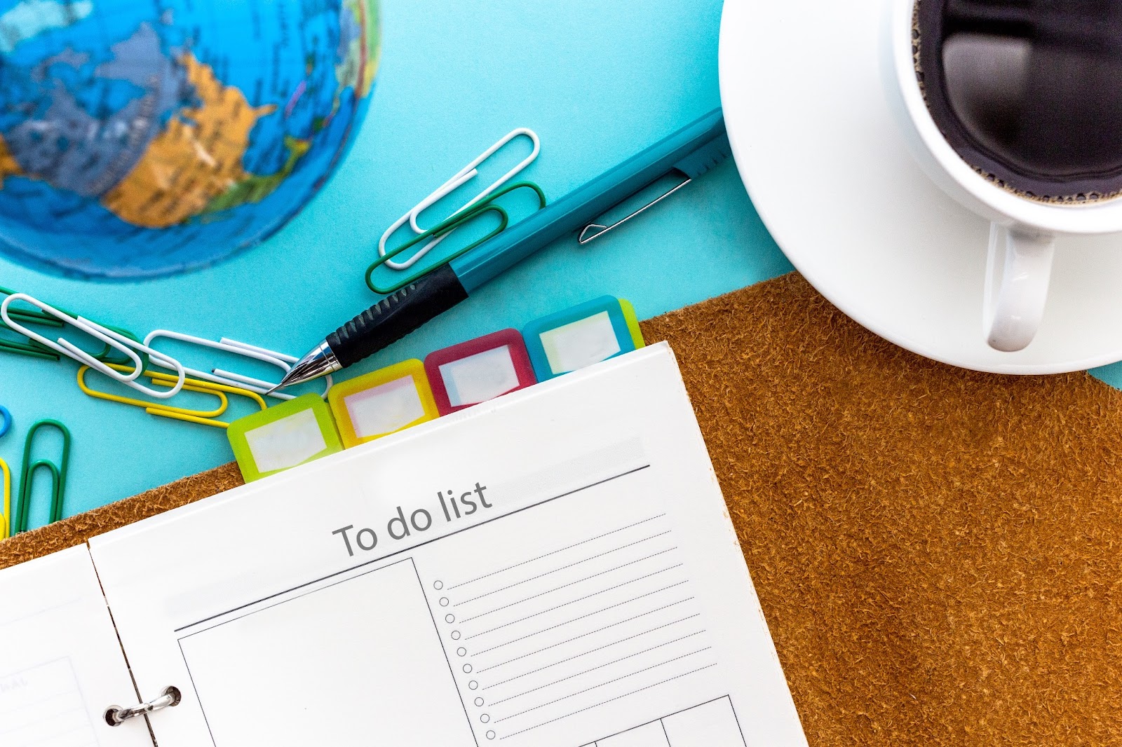 An organized planner with a checklist to use when travel planning. 