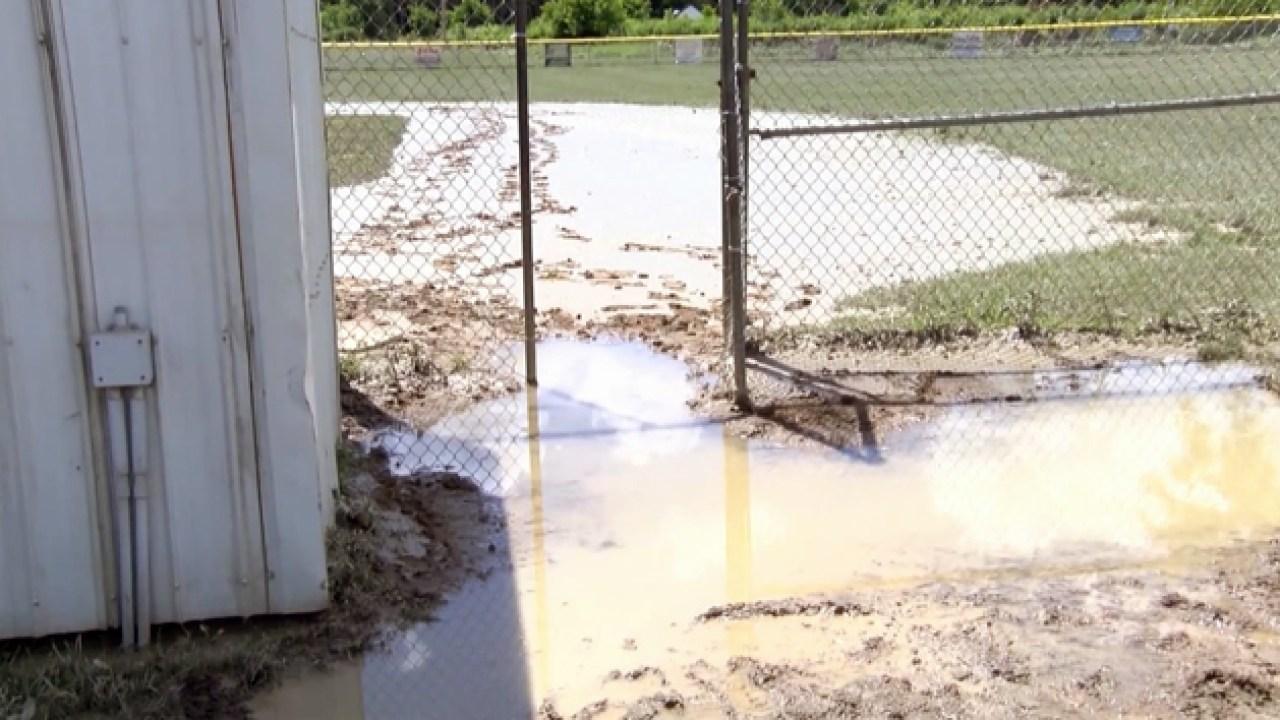 Volunteers work to clean up muddy baseball field after Hoosick Falls ...