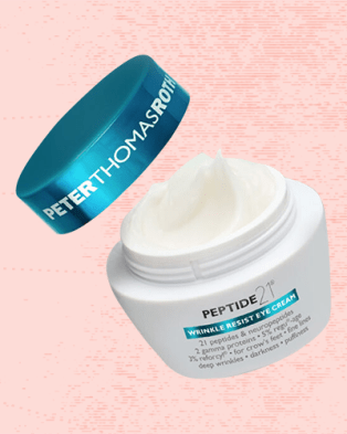 Peter Thomas Roth Peptide 21 Wrinkle Resist Eye Cream against a pale red background.