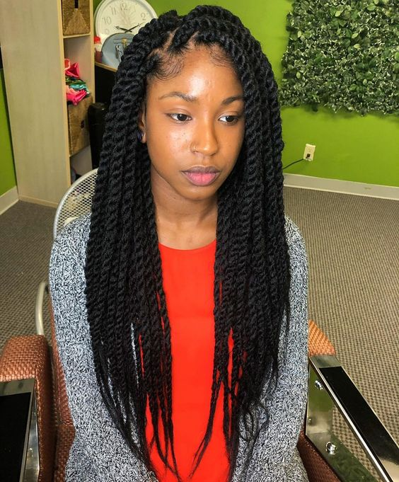 Full picture of  a lady sitting pretty with her cuban twist 