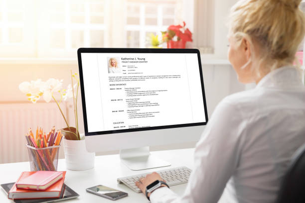 a woman creating a machine operator resume on computer