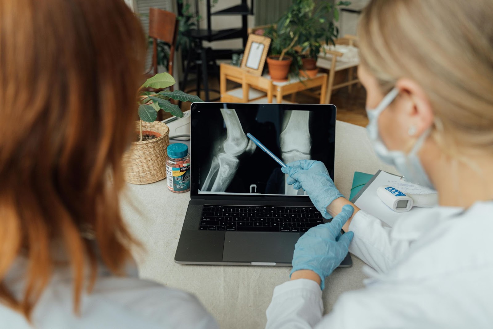 spotcovery-doctors-examining-an-x-ray-image-on-a-laptop-national-walking-day