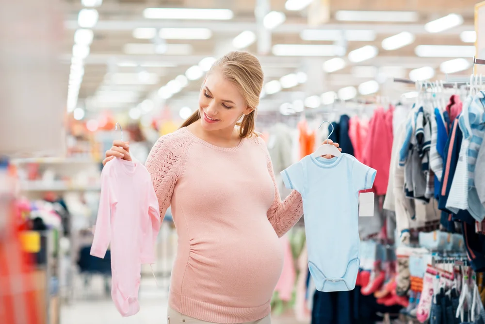 Women checking baby new born baby clothes