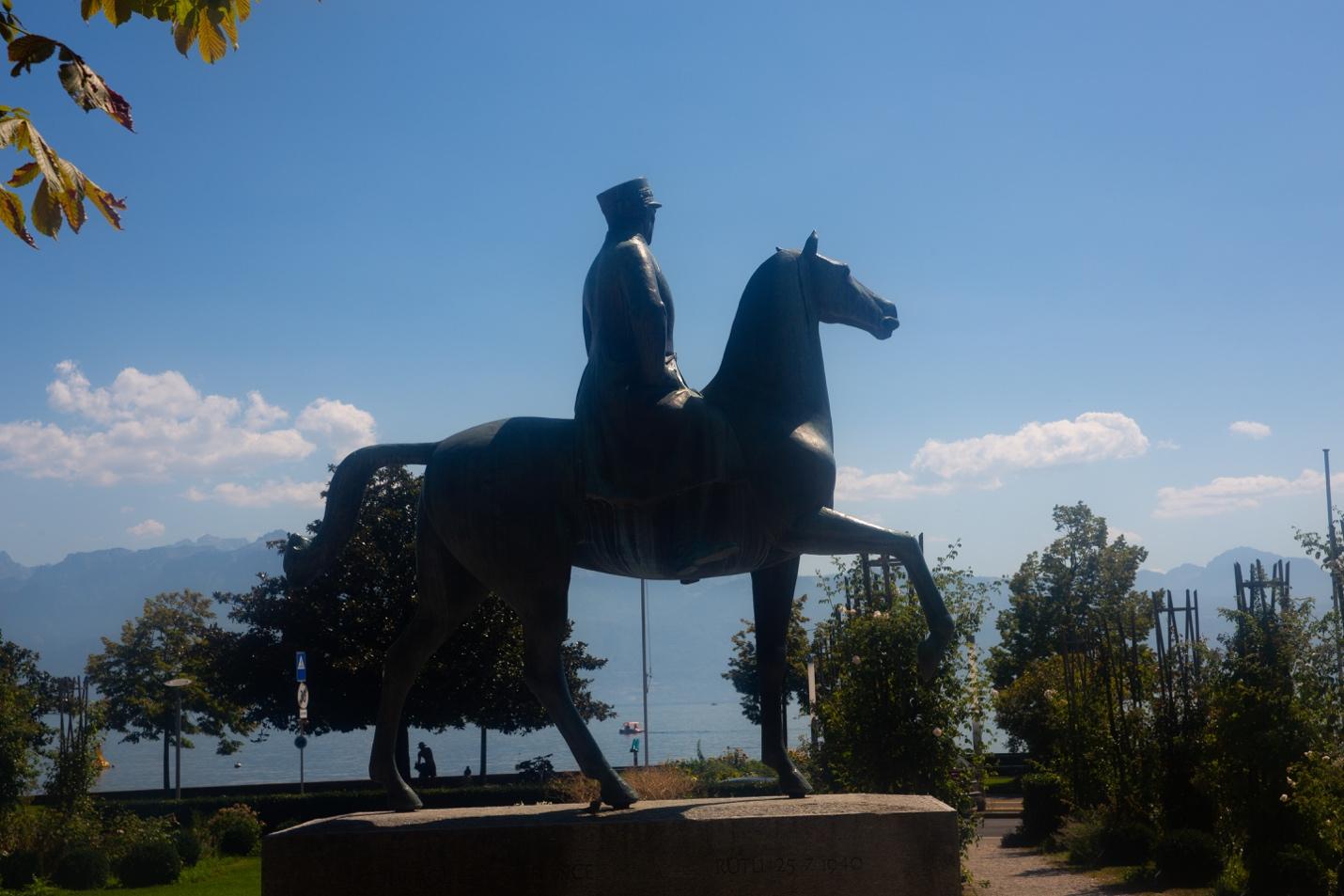 A statue of a person on a horse

Description automatically generated