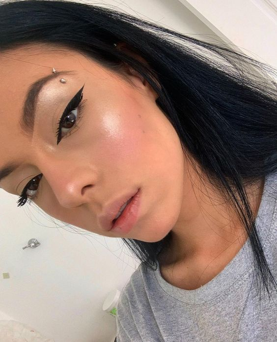 Picture of a lady showcasing her gorgeous 
 brow bling 