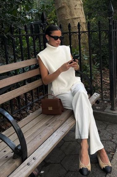 2024 fashion trends: Picture showing a lady in white turtle neck and pant trousers