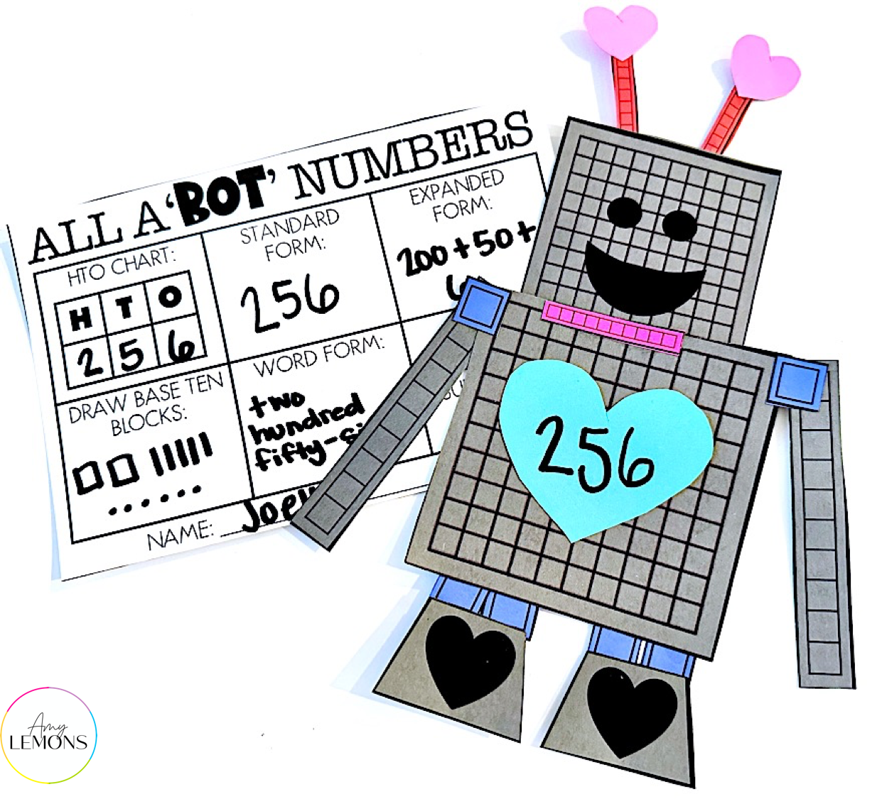 Place value robot math activity for Valentine's Day. Students use number blocks to make a place value Love-Bot.