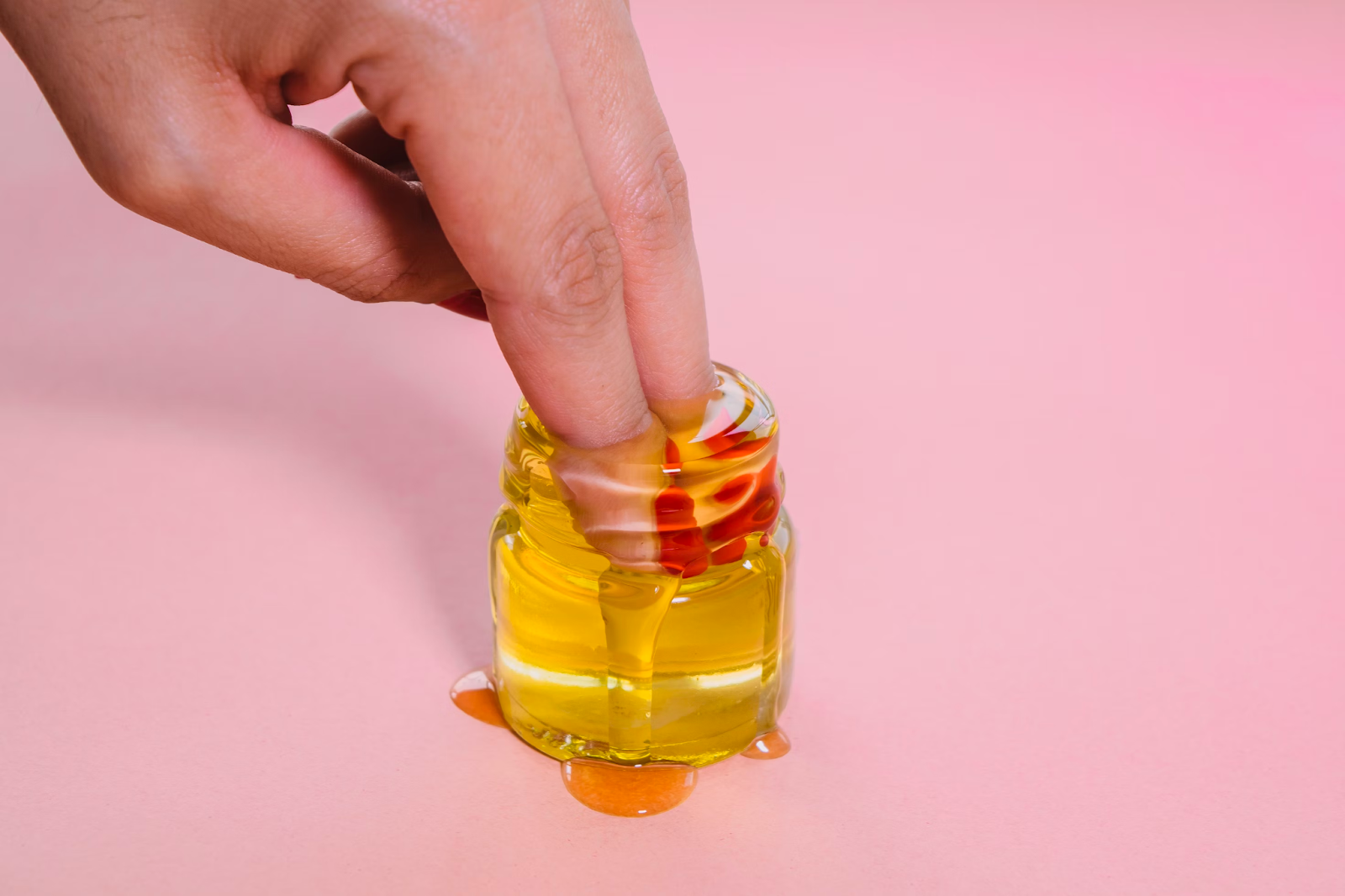 A woman inserting her fingers in lube