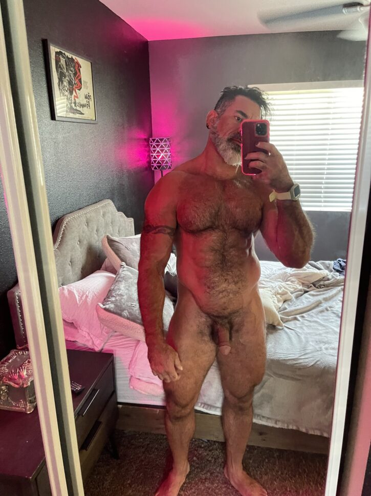 Lawson James posing naked in front of the mirror taking a selfie and showing off his flaccid cut dick