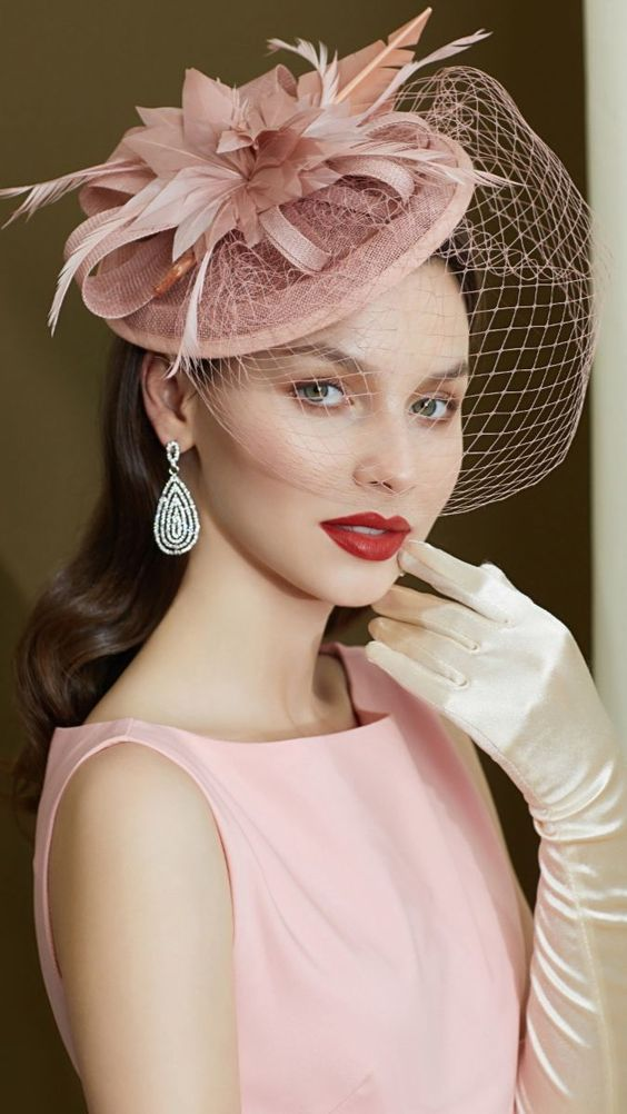 Picture of a lady rocking a gorgeous pink hat and pink dress for a coordinated look