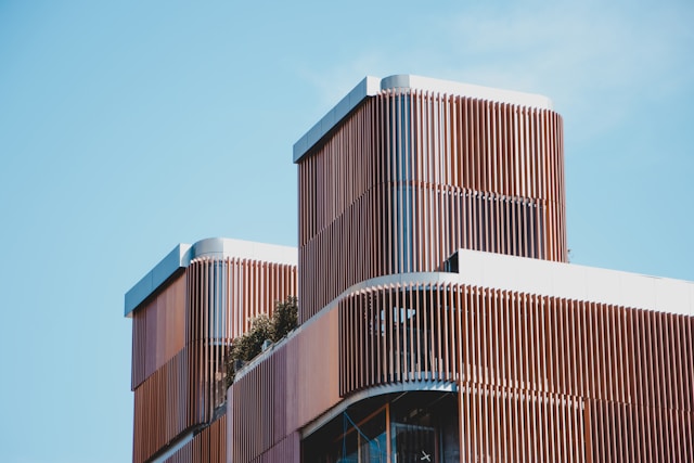 A building with three masses with louvered facade designed using parametric design principles