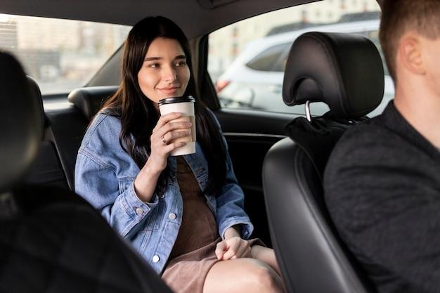 Free photo close up woman holding coffee cup