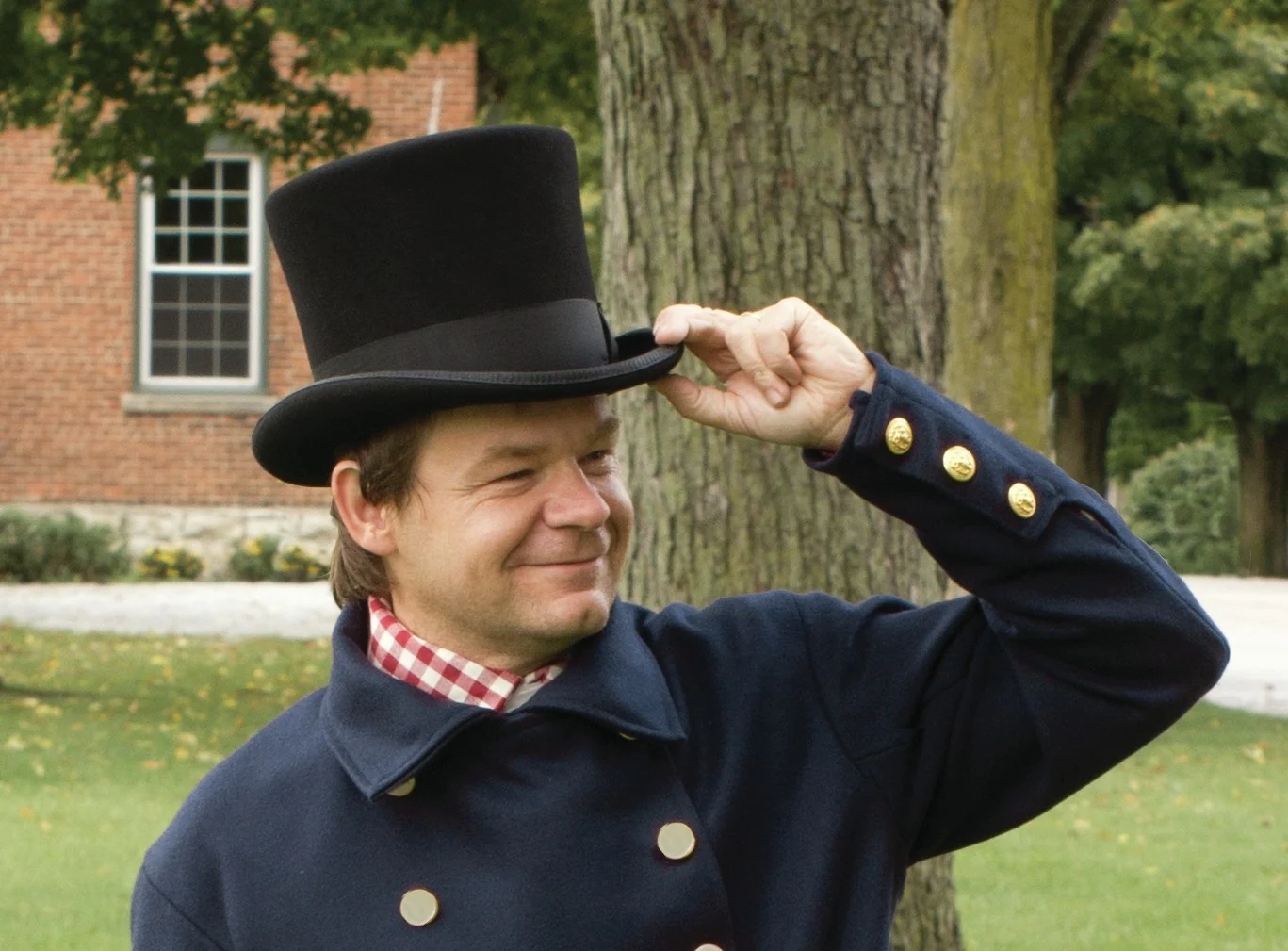 Man shows how good he looks with his top hat