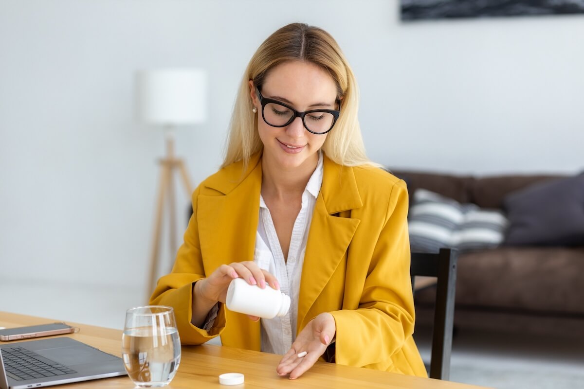 Employee taking a pill