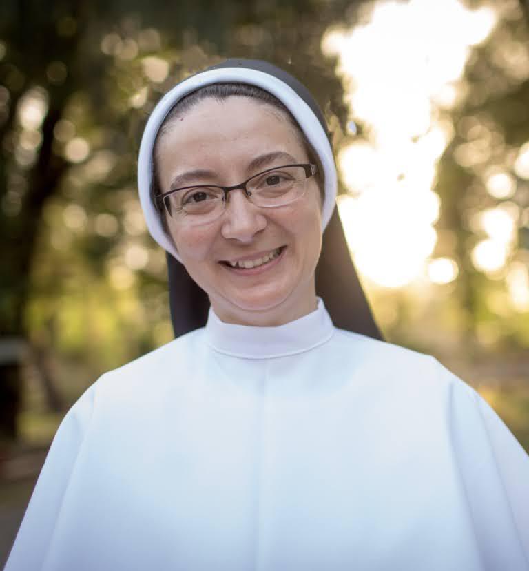 A person in a nun's head Description automatically generated