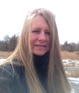 A person with long blonde hair

Description automatically generated