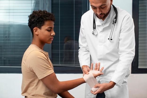 Doctor taking care of afro-american child