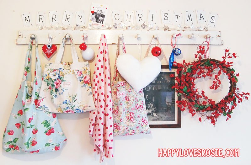 old hooks decorated with christmas decor and merry christmas spelt out in lexicon cards