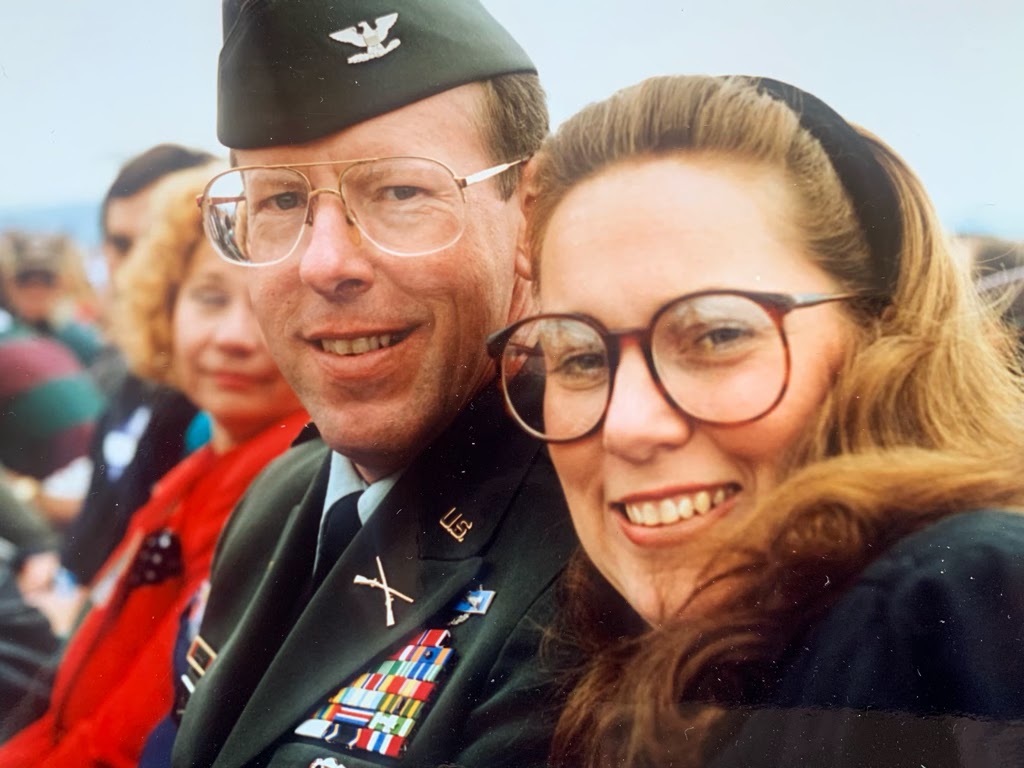 Tom and Bonnie pose for a photo in a crowd