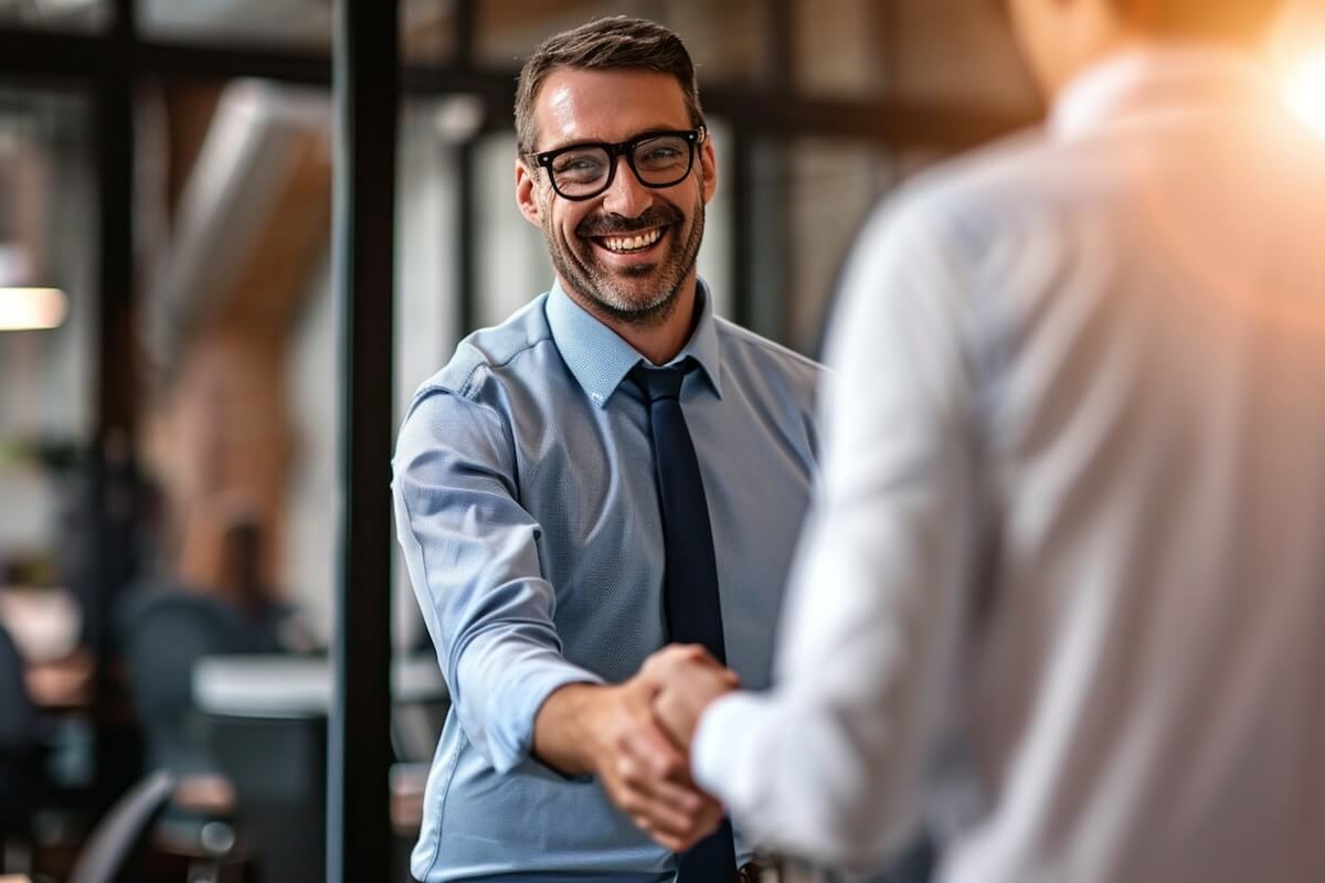 HR manager shaking hands with an entrepreneur